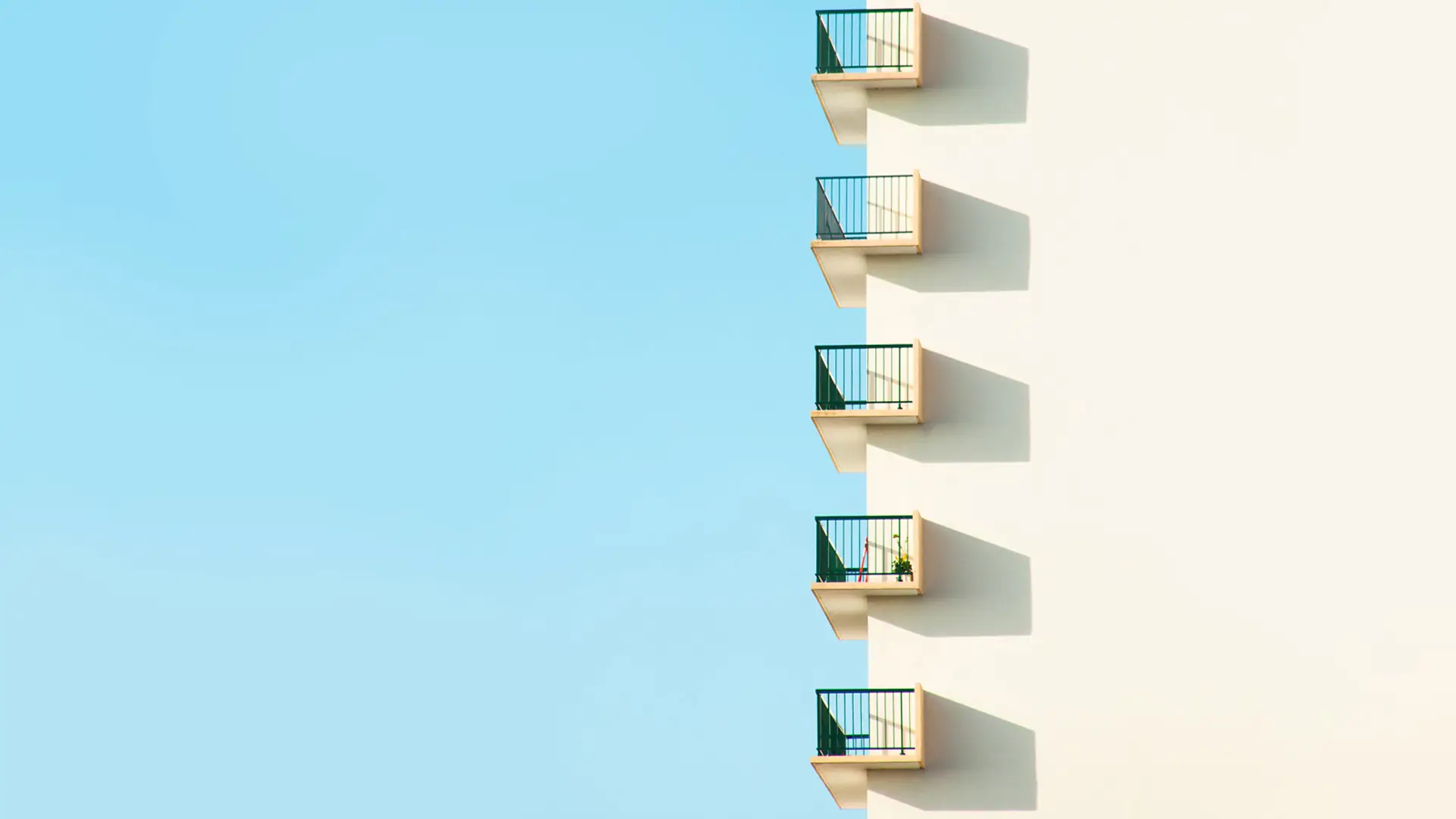 a_white_building_with_balconies.jpg