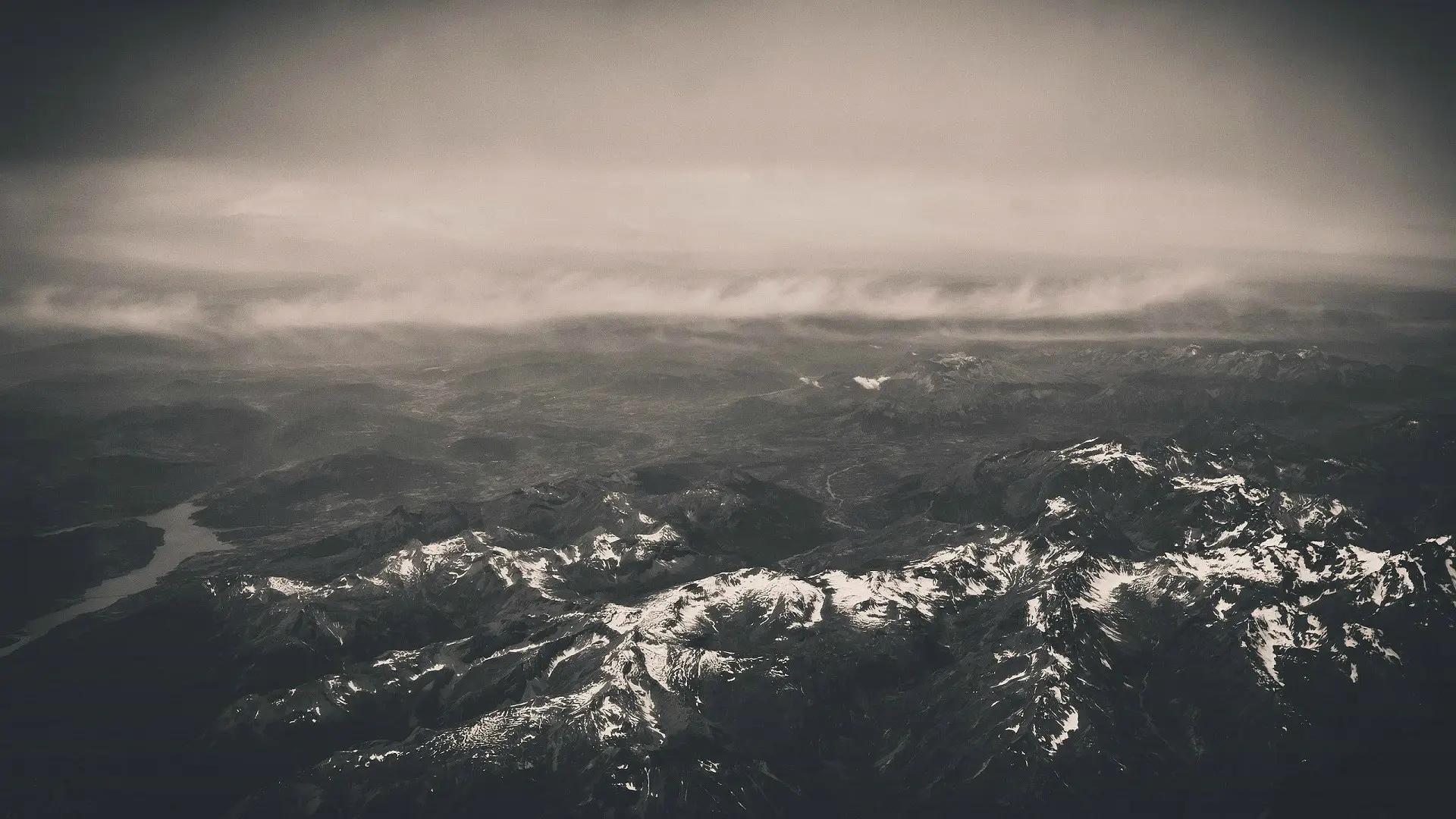 a_aerial_view_of_a_snowy_mountain_range.jpg