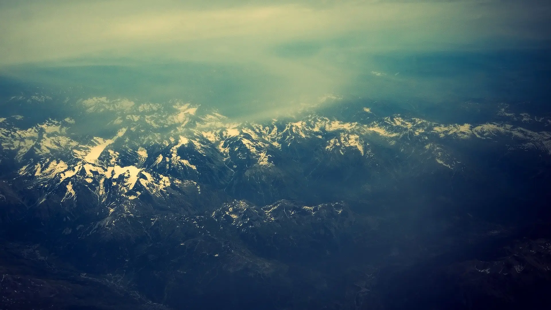 a_aerial_view_of_a_snowy_mountain_range_01.jpg