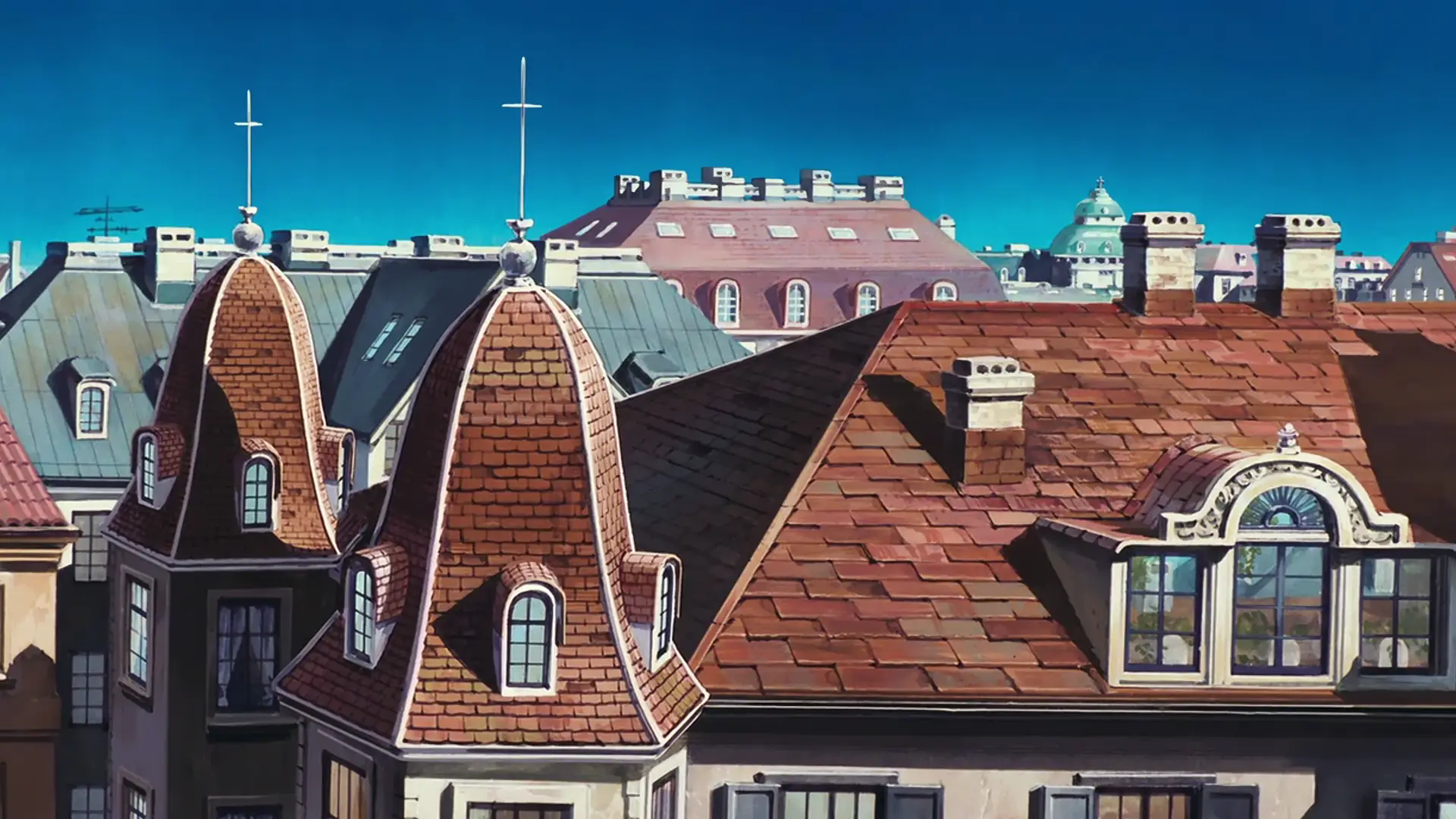 a_group_of_rooftops_with_a_cross_on_top.png