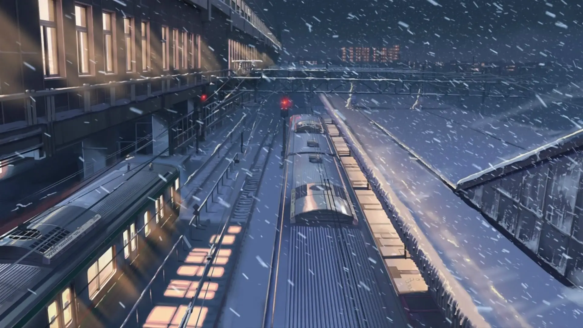 a_train_on_tracks_in_a_snowy_city.jpg