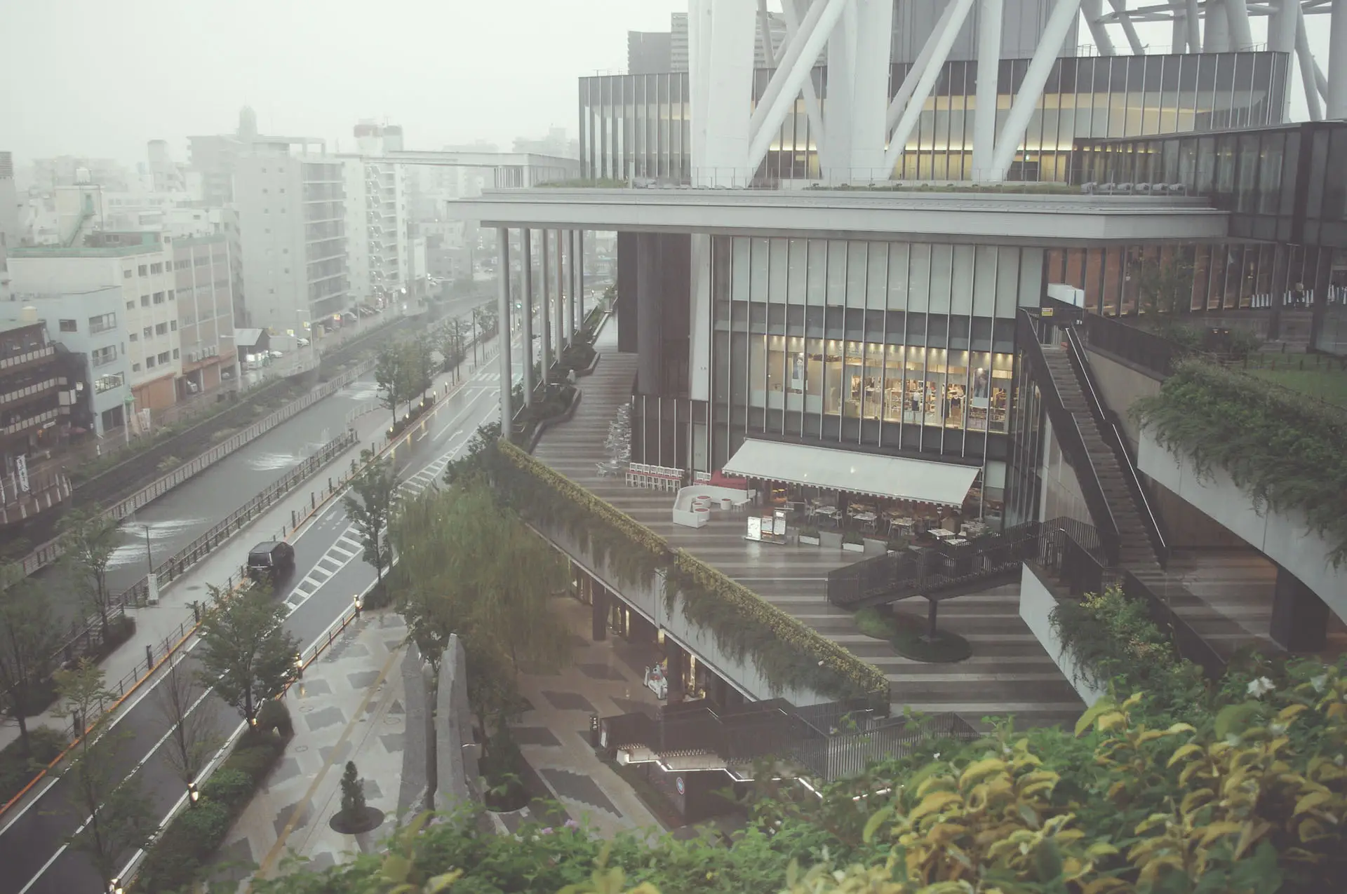 a_building_with_a_walkway_and_trees.jpg