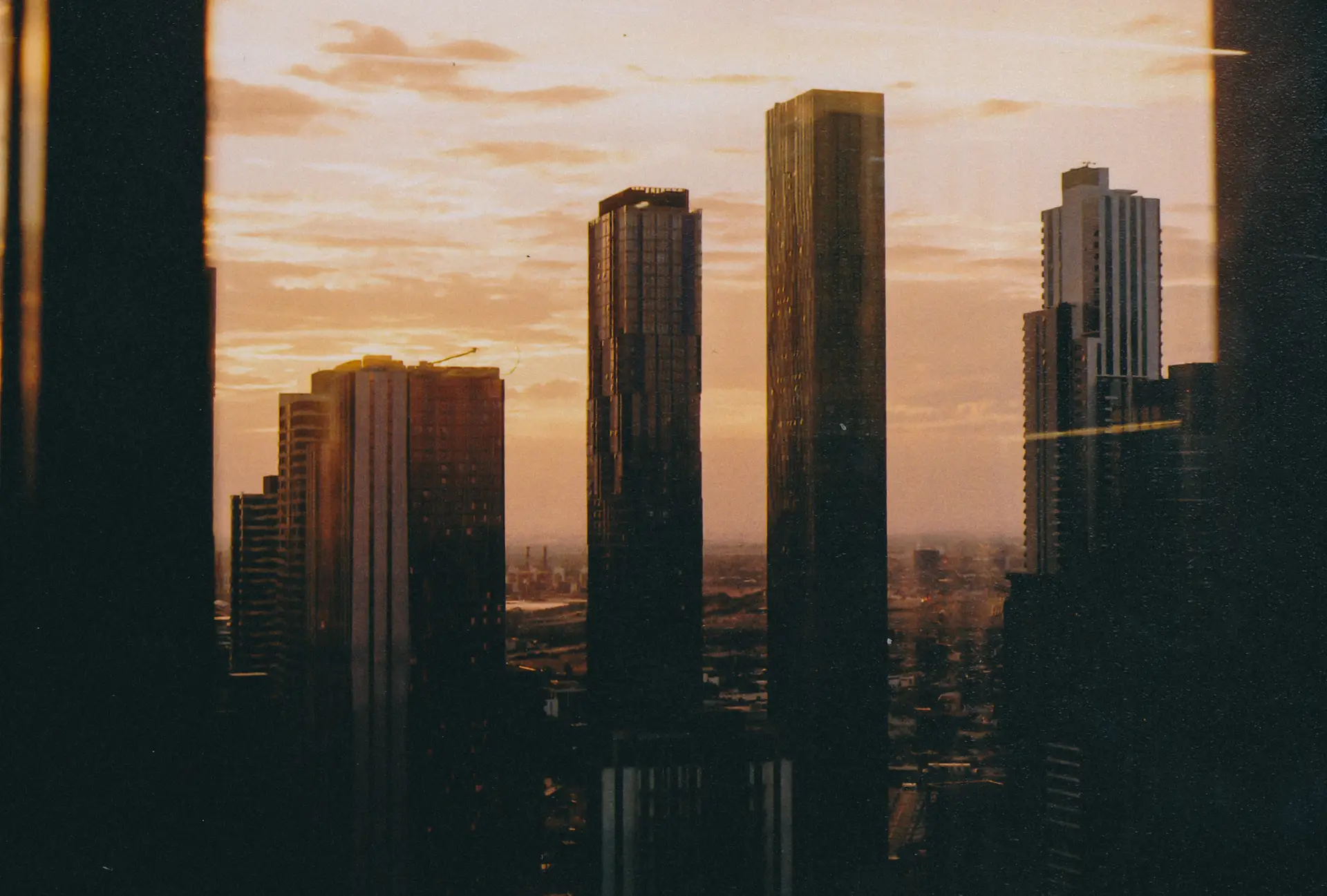 a_group_of_tall_buildings_in_a_city.jpg