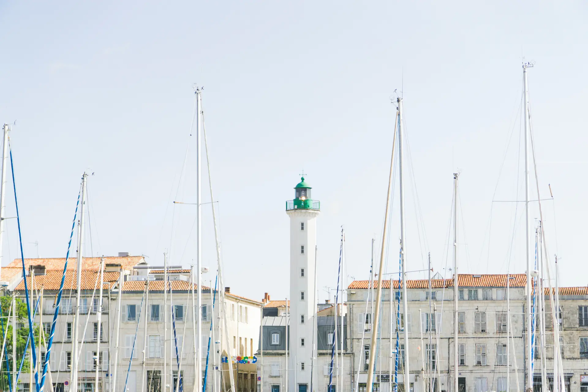 a_lighthouse_in_front_of_a_building.jpg