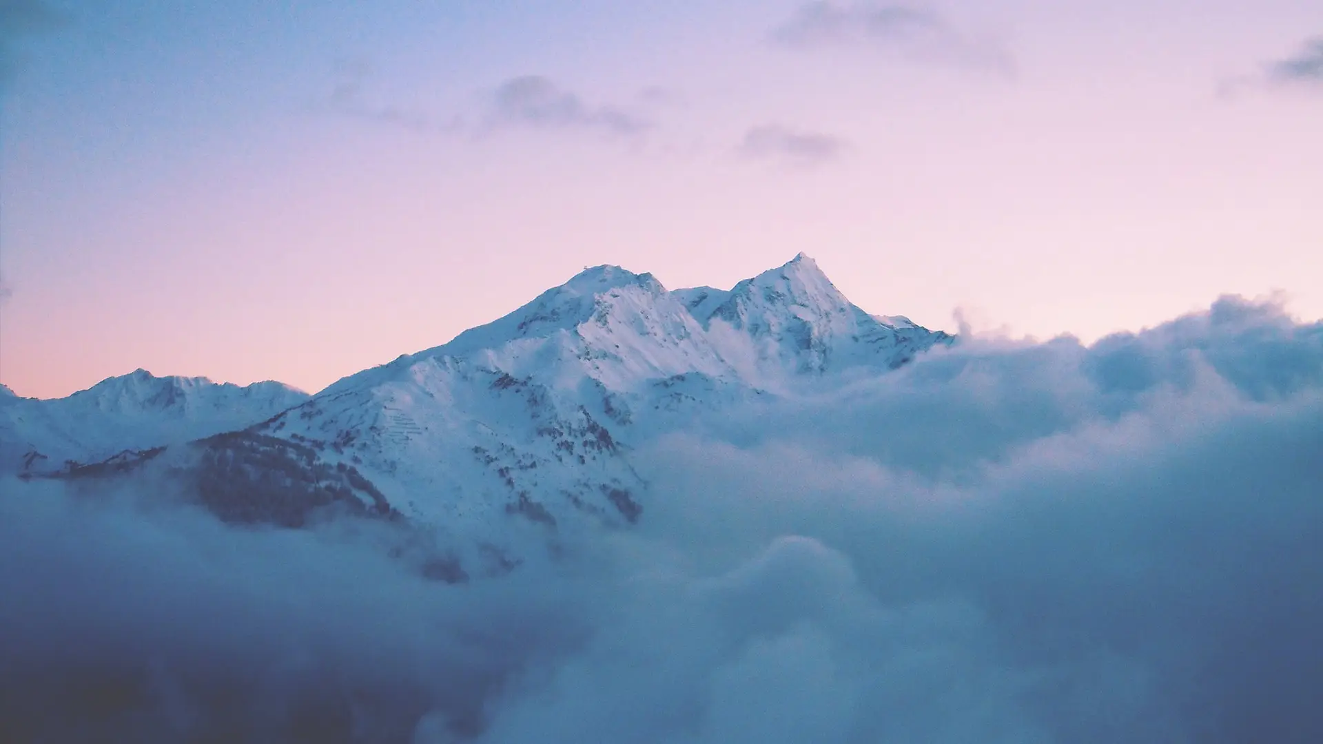 a_mountain_with_snow_and_clouds.jpg