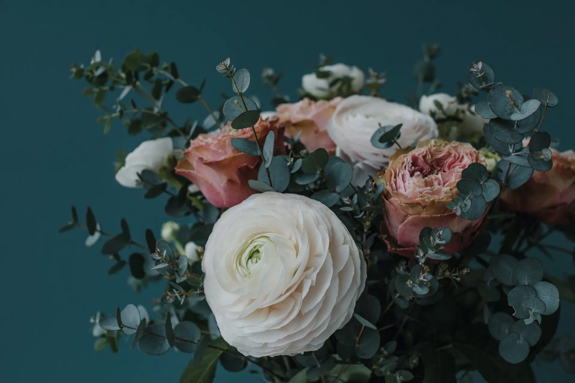 a_bouquet_of_flowers_with_green_leaves.jpg