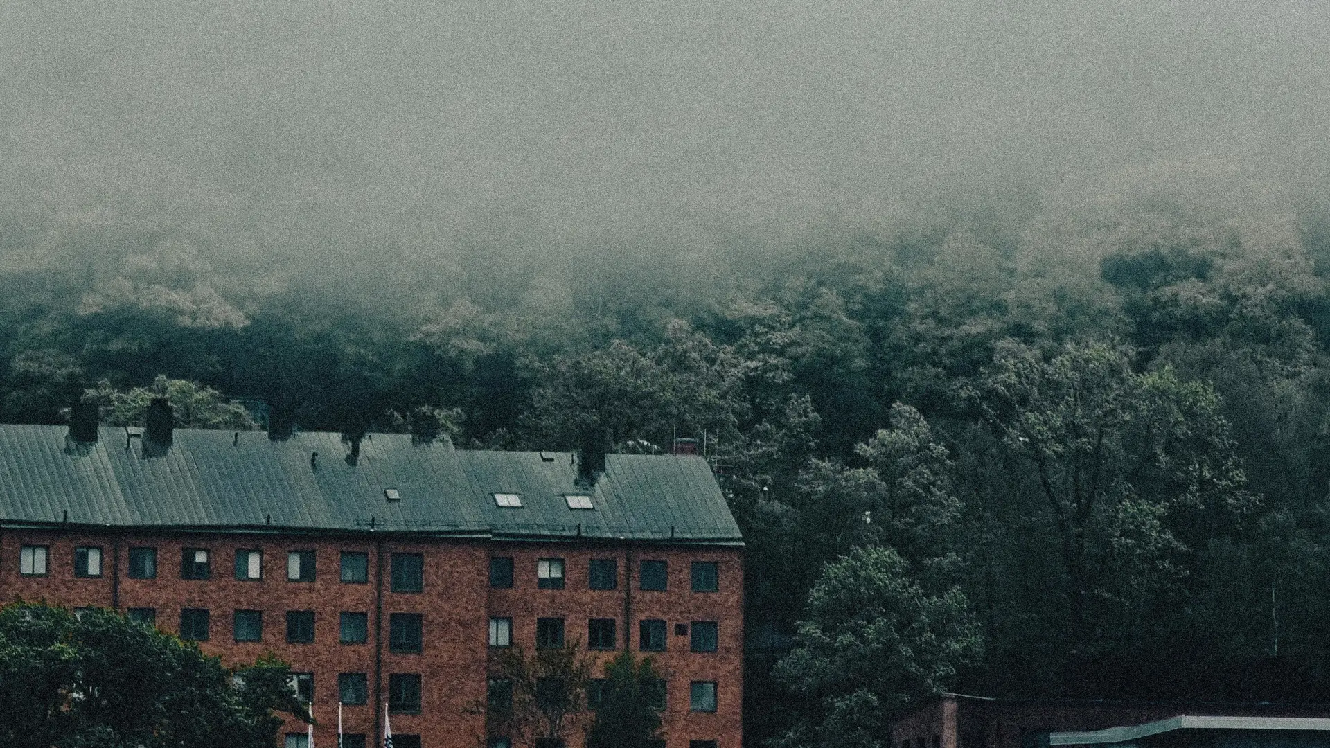 a_building_with_trees_in_the_background.jpg