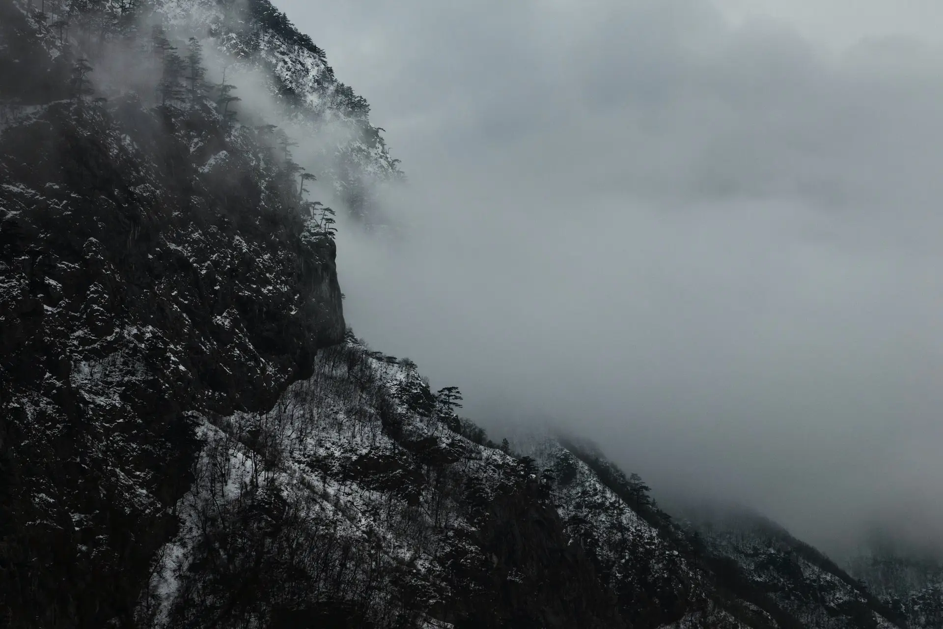 a_mountain_with_snow_and_clouds.jpg