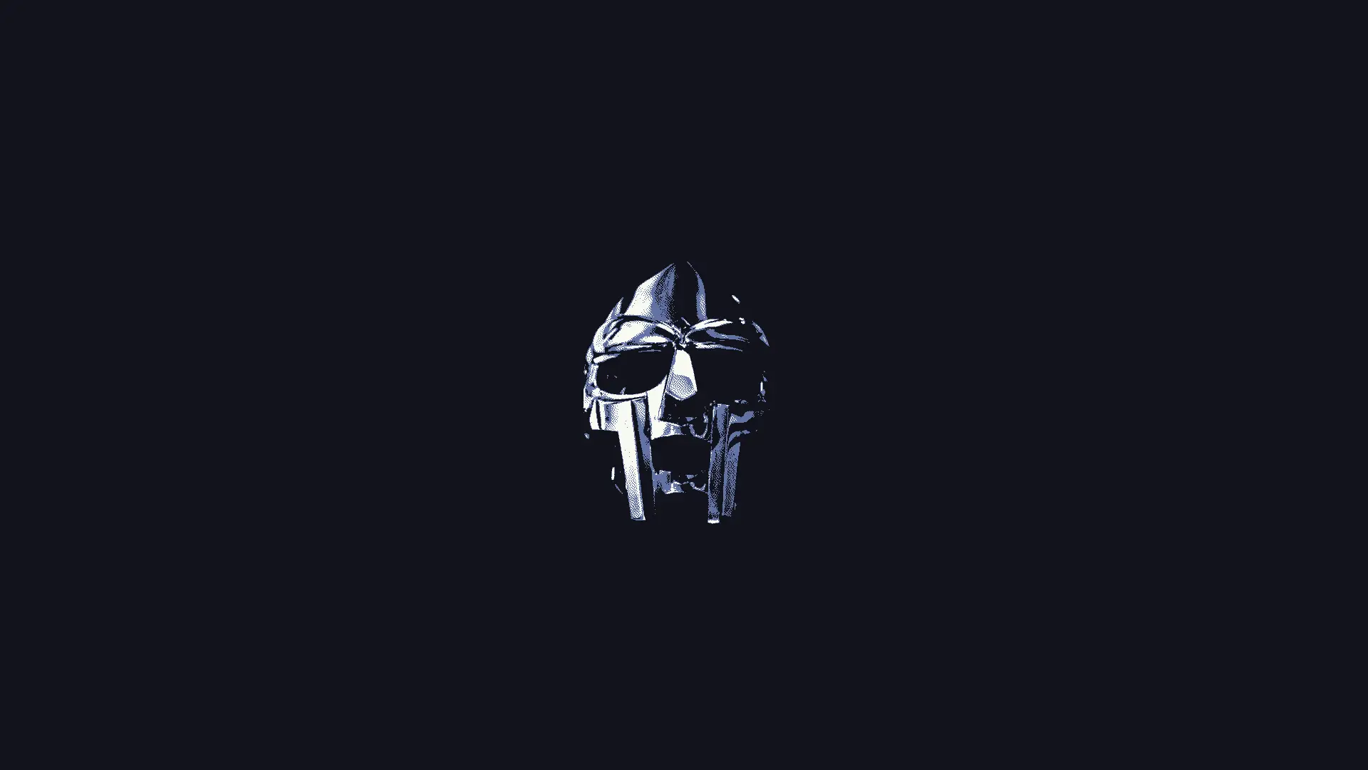 a_silver_metal_mask_with_a_black_background.png