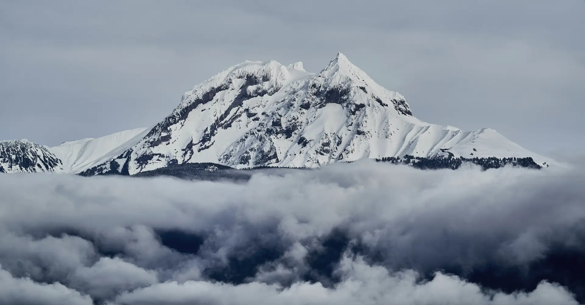 a_mountain_with_snow_and_clouds.jpg