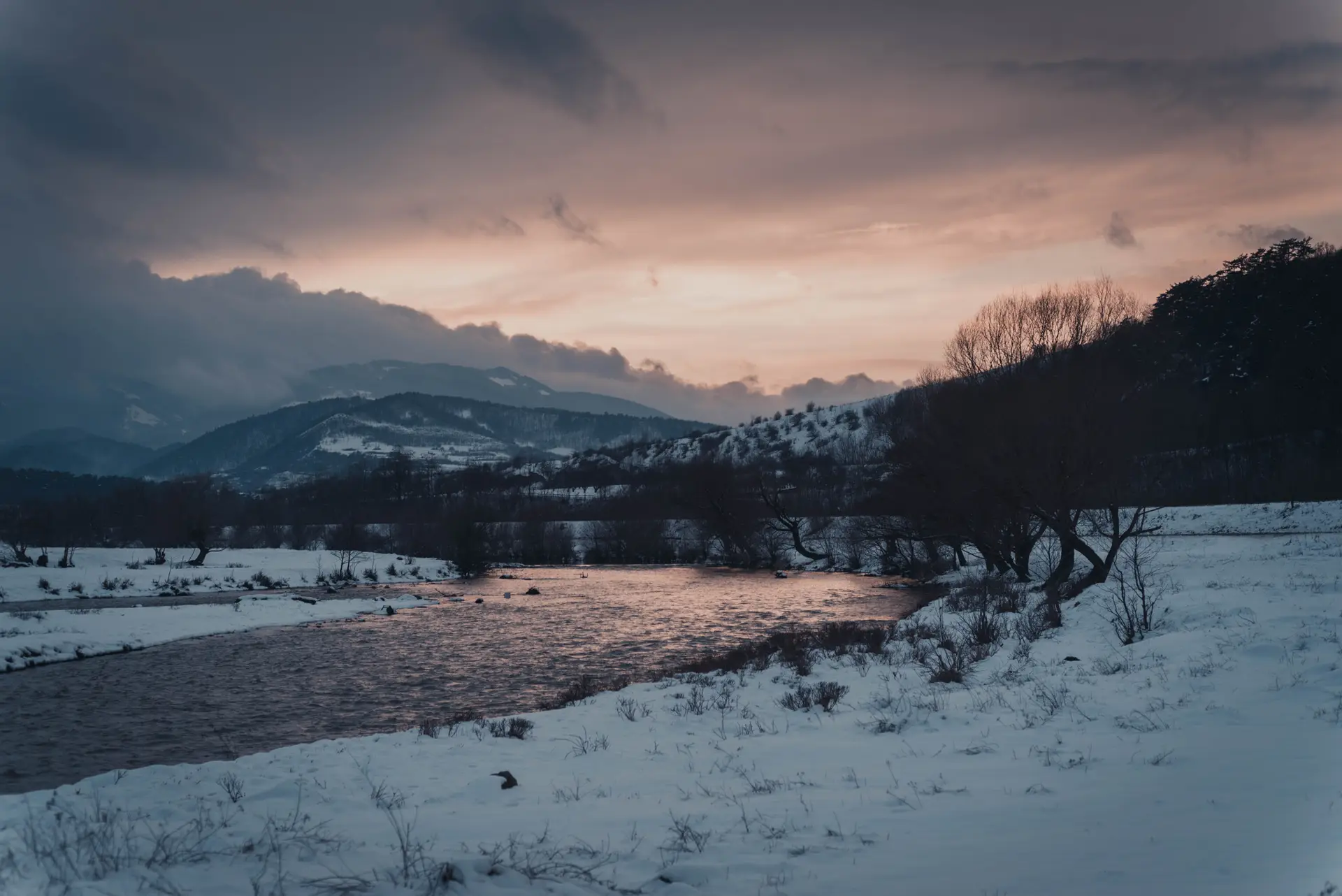 a_river_in_a_snowy_landscape.jpg