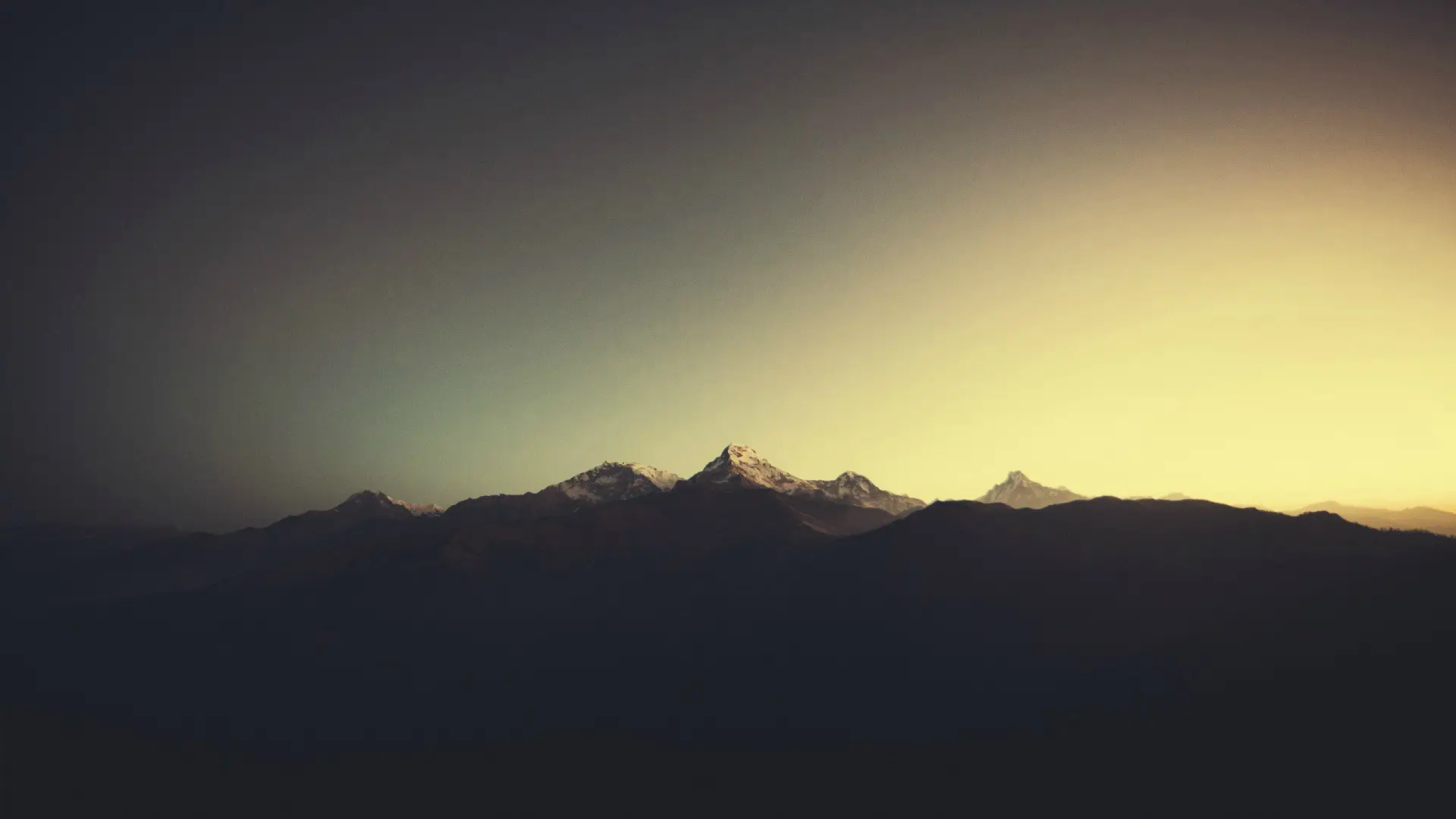 a_mountain_range_with_snow_on_top.jpg