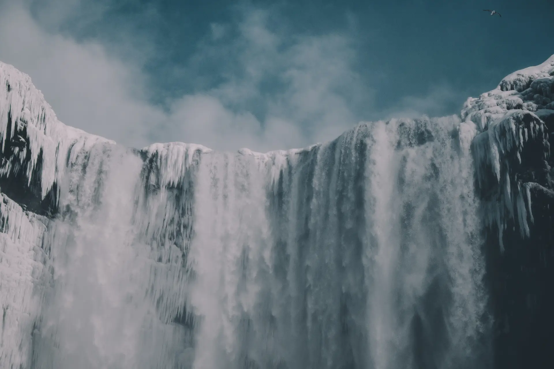 a_large_waterfall_with_snow_and_ice.jpg